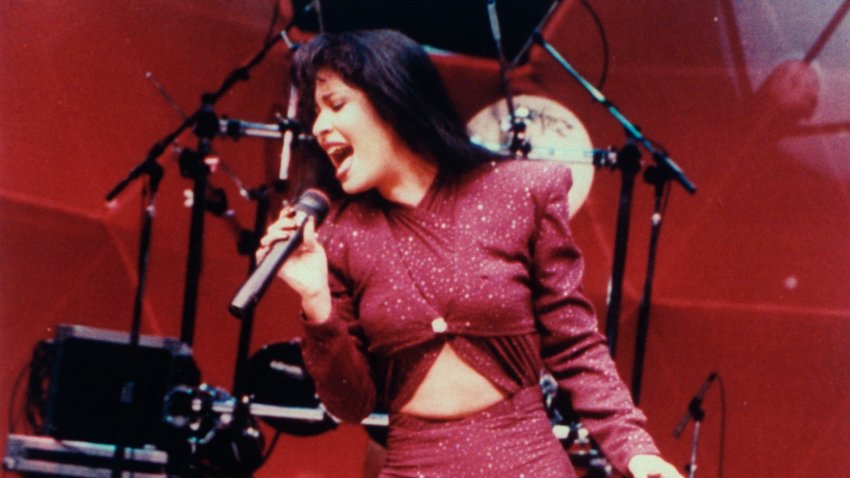 Mexican singer Selena performing in concert; one month later she would be shot and killed by Yolanda Saldivar, the pres. of her fan club, after confronting her on charges that she was embezzling funds.