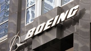 The Boeing logo hangs on the corporate world headquarters