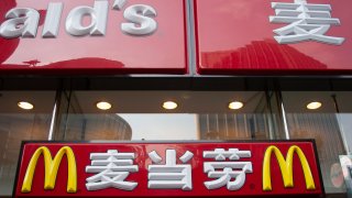 McDonalds sign in Chinese and English text in Shanghai, China.