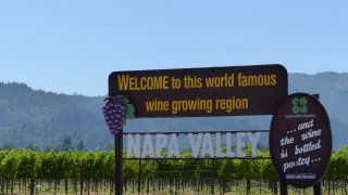 A sign that reads Welcome to this world famous wine growing region, NAPA VALLEY" is standing at the entrance of the wine region "Napa Valley" in Napa, United States, 19 July 2017.