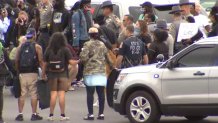 Connecticut State troopers seen standing arm in arm with protesters calling for justice for George Floyd in Hartford, Conn. on June 1, 2020.