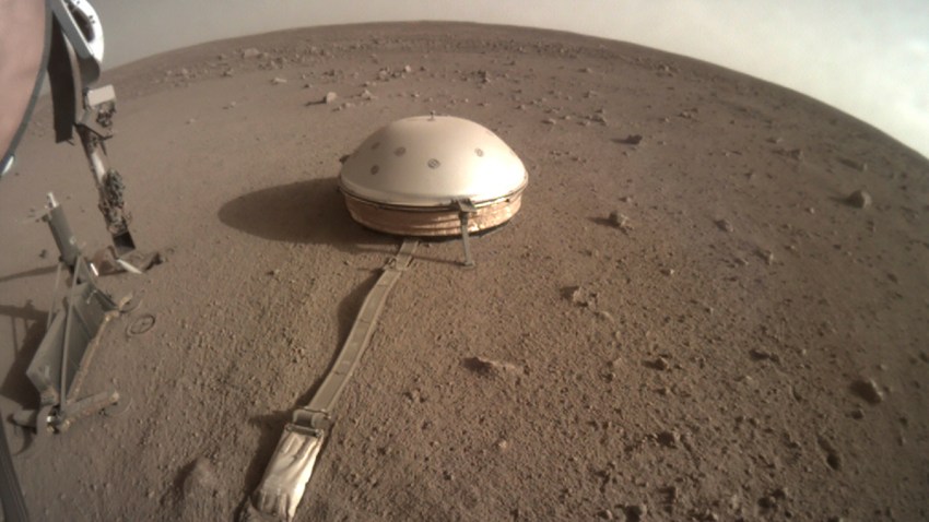 This Feb. 18, 2020 photo made available by NASA shows the InSight lander's dome-covered seismometer, known as SEIS, on Mars.