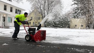Person using snowblower to clear wnow