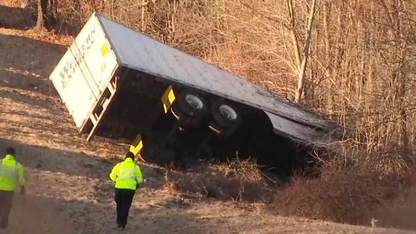 Milford truck down embankment