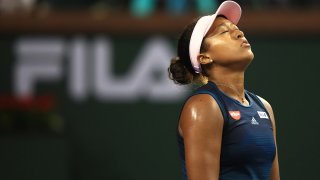 In this March 12, 2019, file photo, Naomi Osaka of Japan reacts after a shot by Belinda Bencic of Switzerland during their women's singles fourth round match on day nine of the BNP Paribas Open at the Indian Wells Tennis Garden in Indian Wells, California.