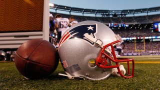 In this Aug. 29, 2012, file photo, a New England Patriots helmet sits on the sideline next to a football during the first half of a preseason NFL football game between the New York Giants and the New England Patriots in East Rutherford, N.J.