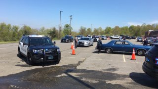 police cruisers lined up for a parade to honor fallen officers