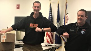 Matt Taylor of RISE (left) delivers care packages to Deputy Chief Ed Podgorski to support Stamford EMS emergency response workers.