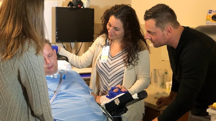 Rich Pawulski surrounded by family at hospital