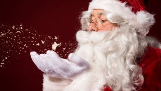 Santa Claus storyblocks-santa-claus-blowing-some-snowflakes_rvlxls-FqM