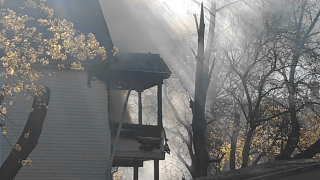A house fire has closed a portion of Rhodes Street in New Britain.