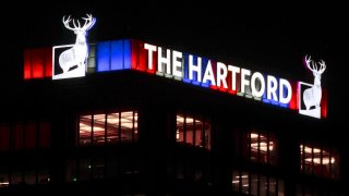 The Hartford sign lit up at night