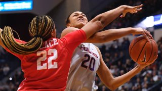 Houston’s KeAsja Peace (22) fouls Connecticut’s Olivia Nelson-Ododa (20) in the first half of an NCAA college basketball game, Saturday, Jan. 11, 2020, in Hartford, Conn. (AP Photo/Jessica Hill)
