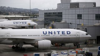 In this file photo, United Airlines planes sit on the tarmac at San Francisco International Airport on July 8, 2015 in San Francisco, California.
