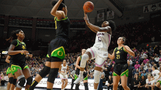Connecticut's Christyn Williams (13) shoots over Oregon's Satou Sabally, front left, in the first half of an NCAA college basketball game, Monday, Feb. 3, 2020, in Storrs, Conn.