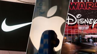 The store logos of Nike, Apple and Disney as seen from left to right.