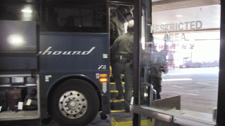 Customs and Border Protection agents board a Greyhound bus