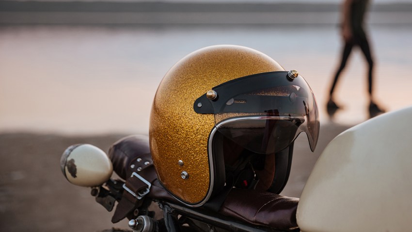 Close up of motorcycle with american flag and golden helmet