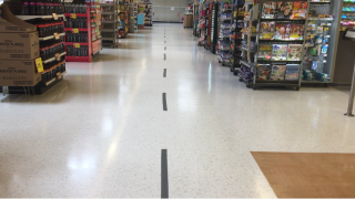 Stores are putting tape on the floor near cash registers to separate customers waiting in line.