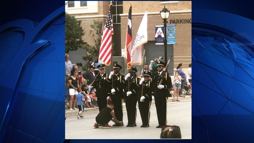 During the 4th of July parade in Arlington Thursday, a boy from the crowd ran out into the parade right in front of the Arlington Police Department Honor Guard.