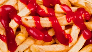 French fries covered in ketchup