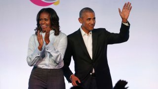 In this Oct. 13, 2017 file photo, former President Barack Obama, right, and former first lady Michelle Obama arrive for the first session of the Obama Foundation Summit in Chicago.
