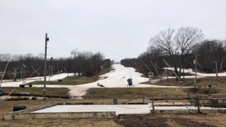 grassy areas showing in the snow at Powder Ridge