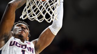 Connecticut's Christian Vital (1) dunks to put the team ahead during the second half of an NCAA college basketball game against South Florida Sunday, Feb. 23, 2020, in Storrs, Conn.