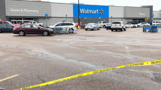 Police tape blocks off a Walmart store parking lot in Forrest City, Ark., on Monday, Feb. 10, 2020. Police say at least three people, including two officers, have been shot this Walmart in eastern Arkansas.