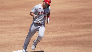 Los Angeles Angels' Mike Trout rounds the bases after hitting a three-run home run against the Oakland Athletics during the third inning of a baseball game in Oakland, Calif., Sunday, July 26, 2020.