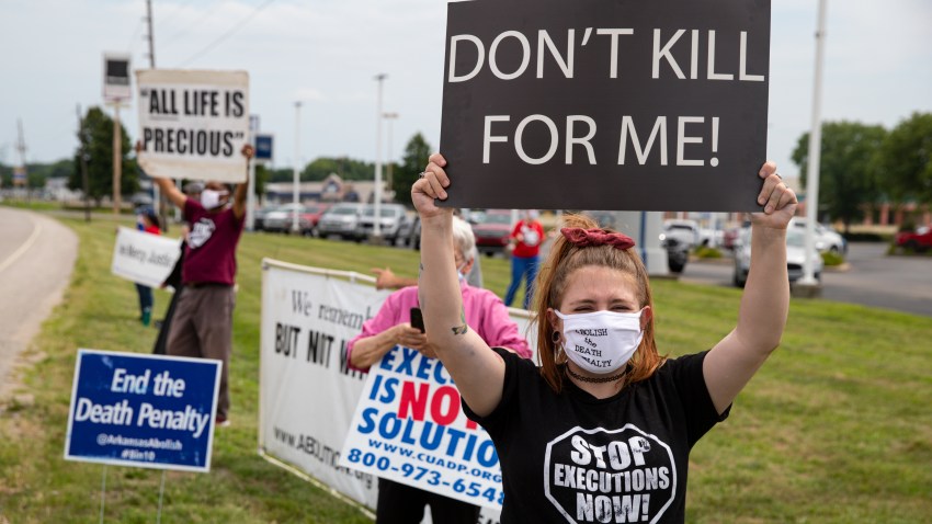 Protesters against the death penalty gather in Terre Haute, Ind., Wednesday, July 15, 2020. Wesley Ira Purkey, convicted of a gruesome 1998 kidnapping and killing, is scheduled to be executed Wednesday evening at the federal prison in Terre Haute.