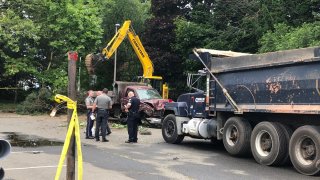 heavily damaged dump truck