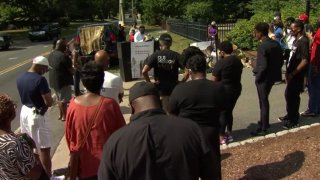 Protesters gathered at the Governor’s Mansion Wednesday, calling on Gov. Ned Lamont to apologize for remarks he made that included the phrase “40 acres and a mule.”