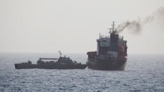 In this Wednesday, Aug. 12, 2020 photo released by the U.S. Navy, the MT Wila is boarded by Iranian navy commandos in the Gulf of Oman off the eastern coast of the United Arab Emirates. The Iranian navy boarded and briefly seized a Liberian-flagged oil tanker near the strategic Strait of Hormuz amid heightened tensions between Tehran and the U.S., a U.S. military official said Thursday, Aug. 13, 2020.