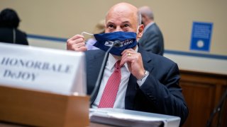 Postmaster General Louis DeJoy removes his face mask as he arrives to testify before a House Oversight and Reform Committee hearing on the Postal Service on Capitol Hill, Monday, Aug. 24, 2020, in Washington.