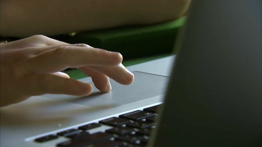 A student works on a computer.