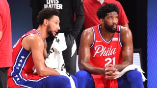 Ben Simmons #25 of the Philadelphia 76ers and Joel Embiid #21 of the Philadelphia 76ers look on during a game against the Washington Wizards