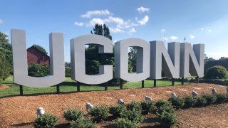 a sign spelling out UConn on the school's campus in Storrs