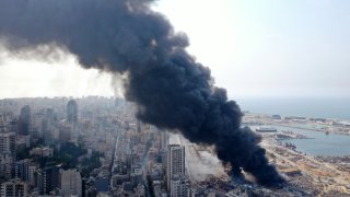 In this Sept. 10, 2020, file photo, an aerial view show the black smoke following a fire that erupted in Beirut Ports Free Zone in Beirut, Lebanon.