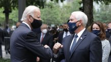 Democratic presidential nominee Joe Biden (L) and U.S. Vice President Mike Pence (R) greet each other during a 9/11 memorial service at the National September 11 Memorial and Museum on September 11, 2020 in New York City.