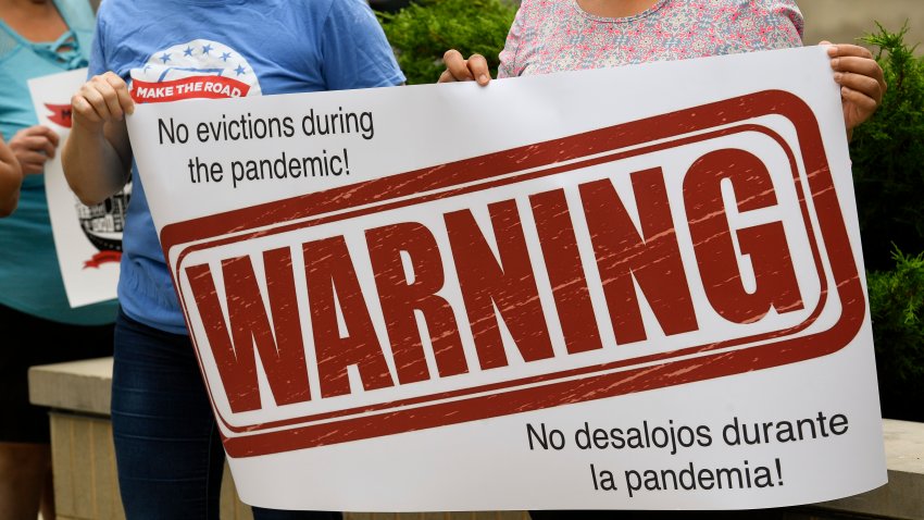 Reading, PA – September 1: Protesters hold a sign that reads “Warning, No evictions during the pandemic! No desalojos durante la pandemia!”During a protest organized by Make the Road Pennsylvania outside the Berks County Services Building in Reading, PA Tuesday afternoon  September 1, 2020 to call for Gov. Wolf and the State Legislature to extend the eviction moratorium in Pennsylvania indefinitely. The group is concerned about the risk of eviction to people affected by the economic downturn resulting from the ongoing COVID-19 / Coronavirus pandemic. (Photo by Ben Hasty/MediaNews Group/Reading Eagle via Getty Images)