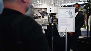 A visitors temperature is taken with an Iris Thermal Scanning device at the entrance to Edge observation deck at Hudson Yards as the city continues Phase 4 of re-opening following restrictions imposed to slow the spread of coronavirus on September 4, 2020 in New York City.
