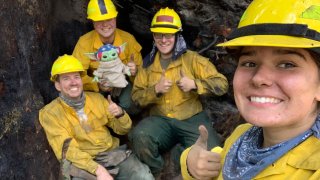 Lucas Galloway, from left, Jaebyn Drake, Rhett Schieder and Audrey Wilcox pose for a selfie with Baby Yoda