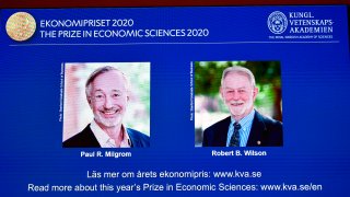 A screen shows pictures of US economists Paul Milgrom (L) and Robert Wilson during the announcement of the winners of the "2020 Nobel Prize Sveriges Riksbank Prize in Economic Sciences in Memory of Alfred Nobel" at the Royal Swedish Academy of Sciences in Stockholm on October 12, 2020.