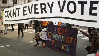Activists in Philadelphia with a 'Count Every Vote' sign