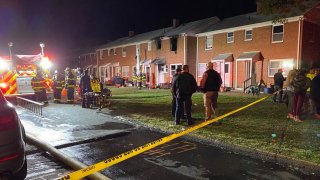 brick apartment building with fire damage