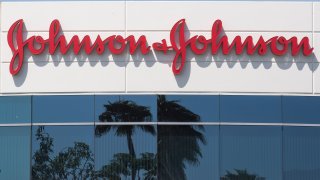 A sign on a building at the Johnson & Johnson campus shows their logo in Irvine, California on August 28, 2019.