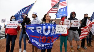 Supporters of President Donald Trump protest outside the Clark County Election Department in Nevada