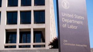 Signage is displayed outside the U.S. Department of Labor building in Washington, D.C., Aug. 18, 2020.