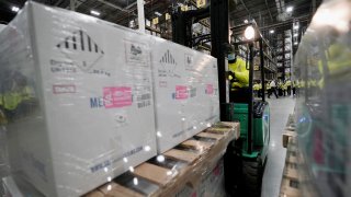 Boxes containing the Pfizer-BioNTech COVID-19 vaccine are prepared to be shipped at the Pfizer Global Supply Kalamazoo manufacturing plant in Portage, Michigan, U.S., December 13, 2020.